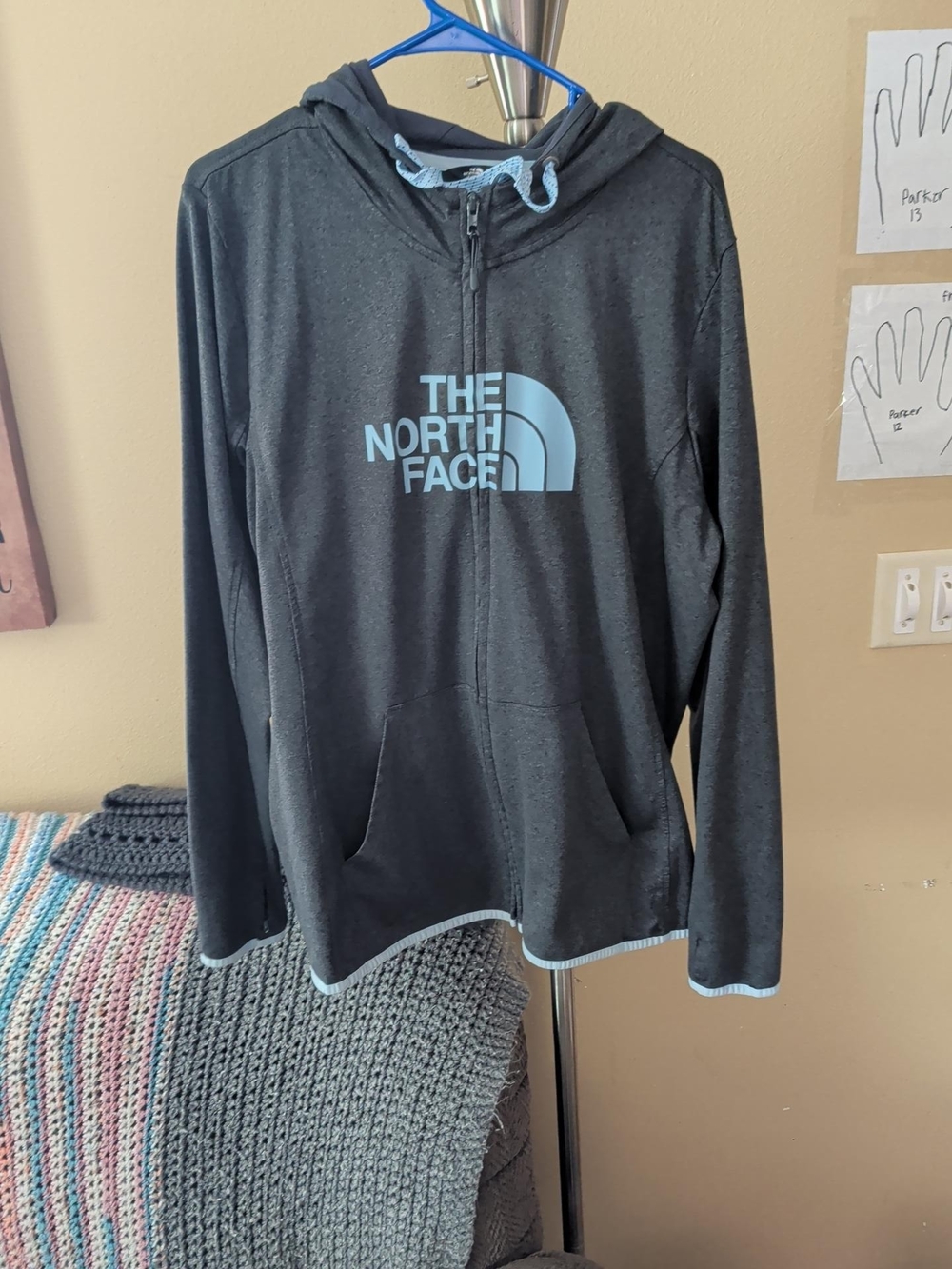The North Face Men's Black Zip-Up Hoodie with Light Blue Logo